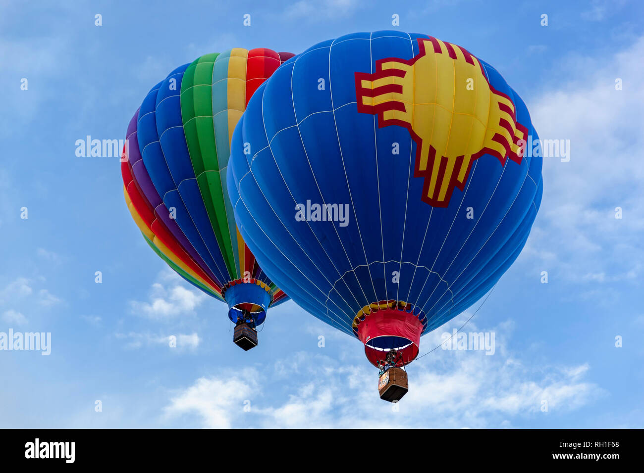 Hot air balloons (foreground with Zia symbol), Albuquerque International Balloon Fiesta, Albuquerque, New Mexico USA Stock Photo