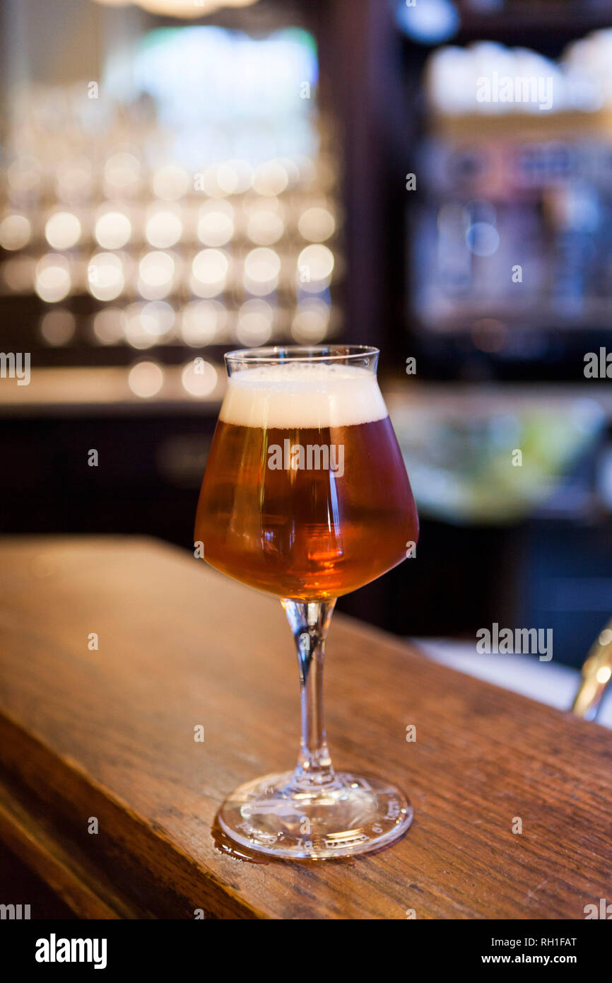 glass of beer in balladin, milan, italy Stock Photo Alamy