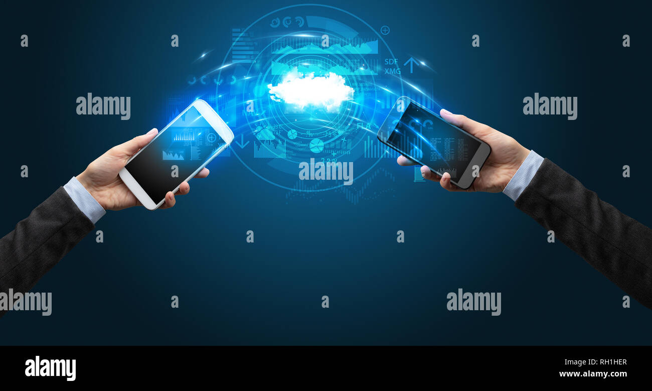 Two mobile phones syncing through the cloud Stock Photo - Alamy
