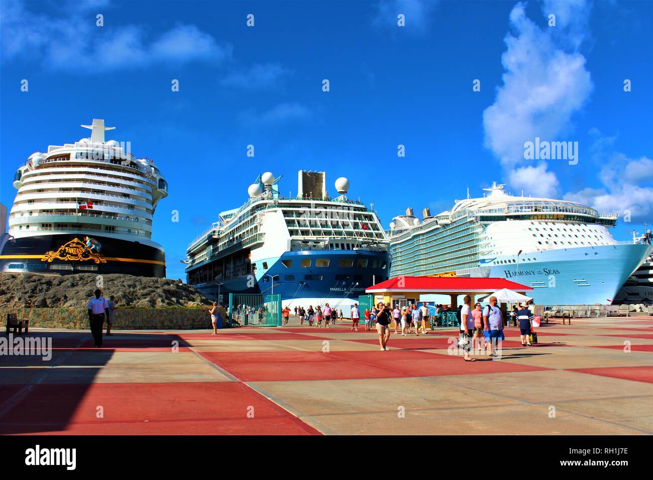 Philipsburg, St Maarten - February 27th 2018: Tourists arrive off of the Disney Fantasy, Marella Discovery & Royal Caribbean Harmony of the Seas ships Stock Photo