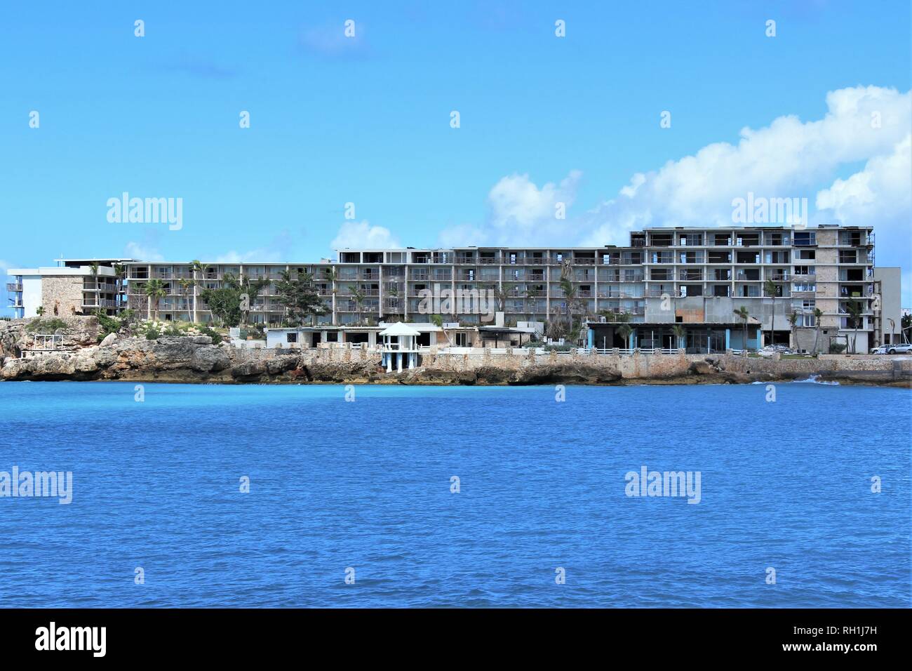 Maho Bay, Sint Maarten - February 27th 2018: The ruins of the Sonesta Beach Resort Hotel, five months on from Hurricane Irma that destroyed it. Stock Photo