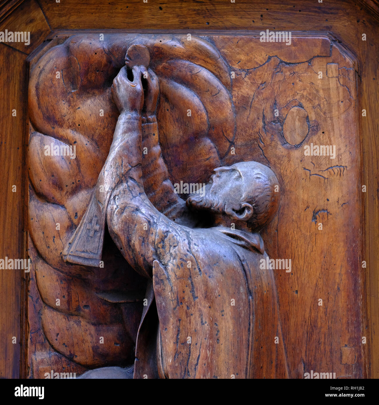 Beautiful carved wooden religious figures decorating the doors of the