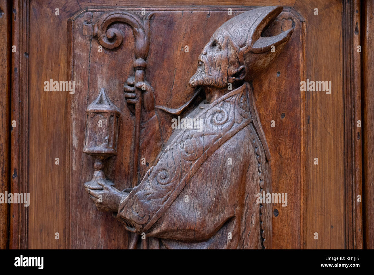 Beautiful carved wooden religious figures decorating the doors of the