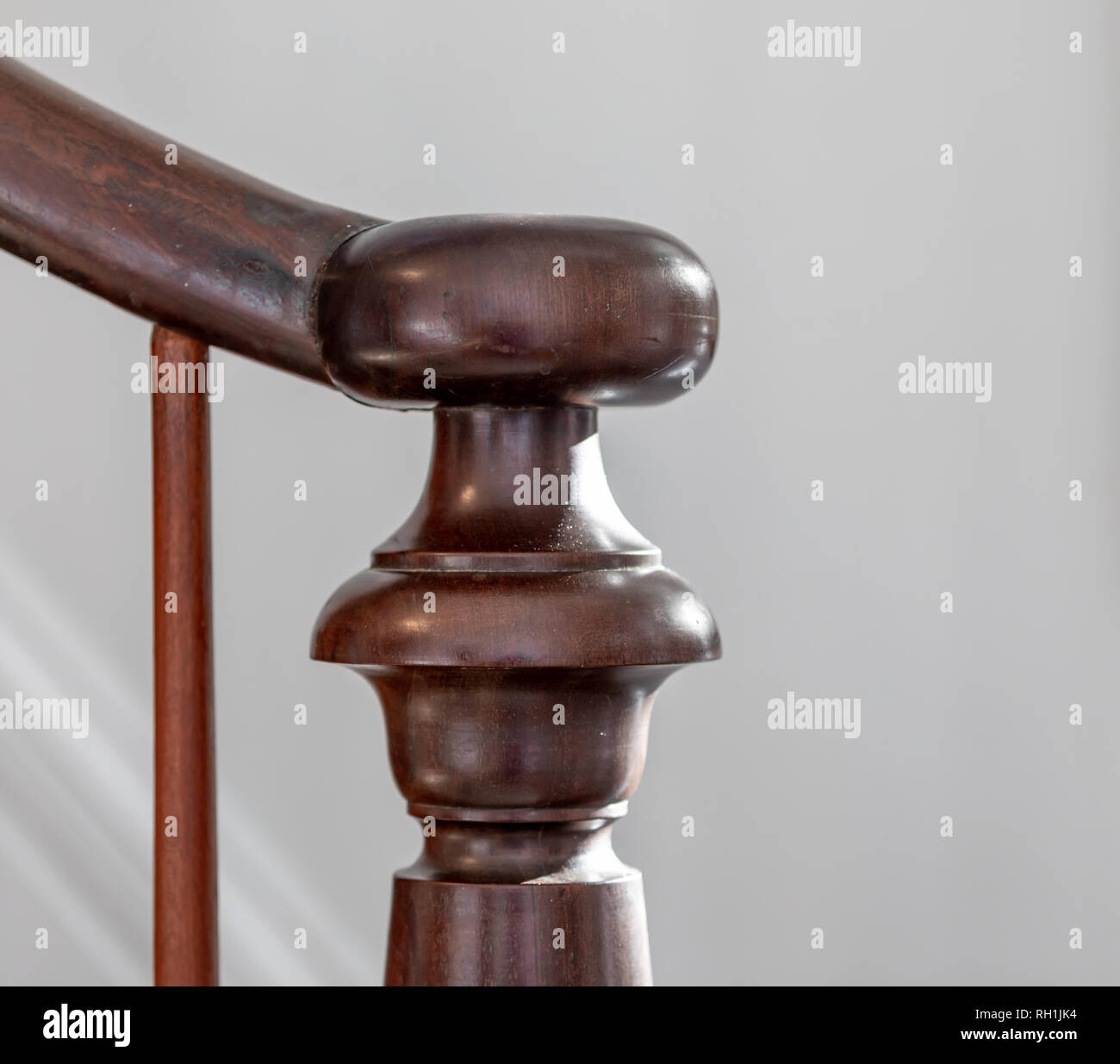 Detail of an old newel post and banister Stock Photo