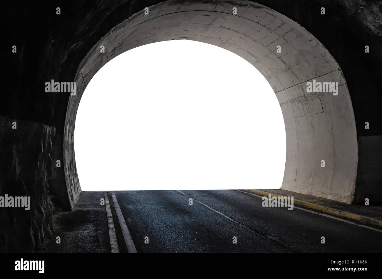 Tunnel in the mountain with a car road and isolated white color exit. Stock Photo