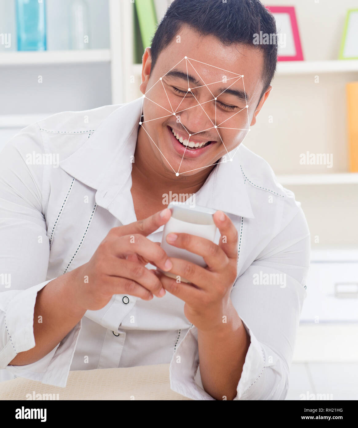 Facial recognition system concept. Asian man with smartphone face ID