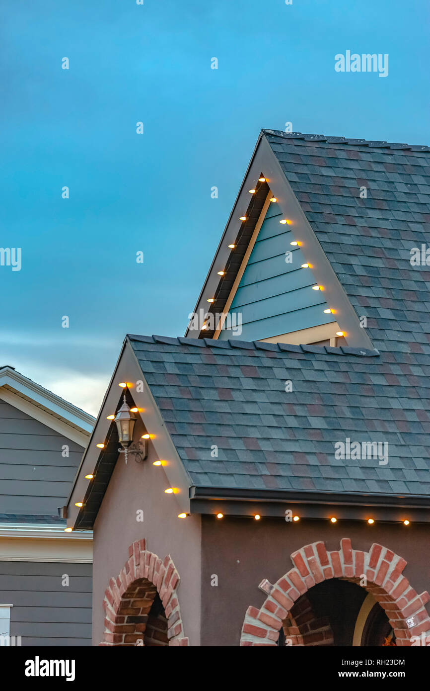 Outdoor Christmas lights on the roof of a home Stock Photo Alamy