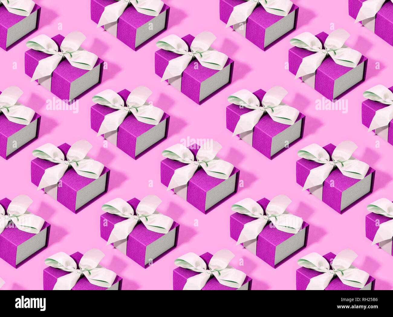 Pattern made of pink gift boxes on pastel background Stock Photo - Alamy