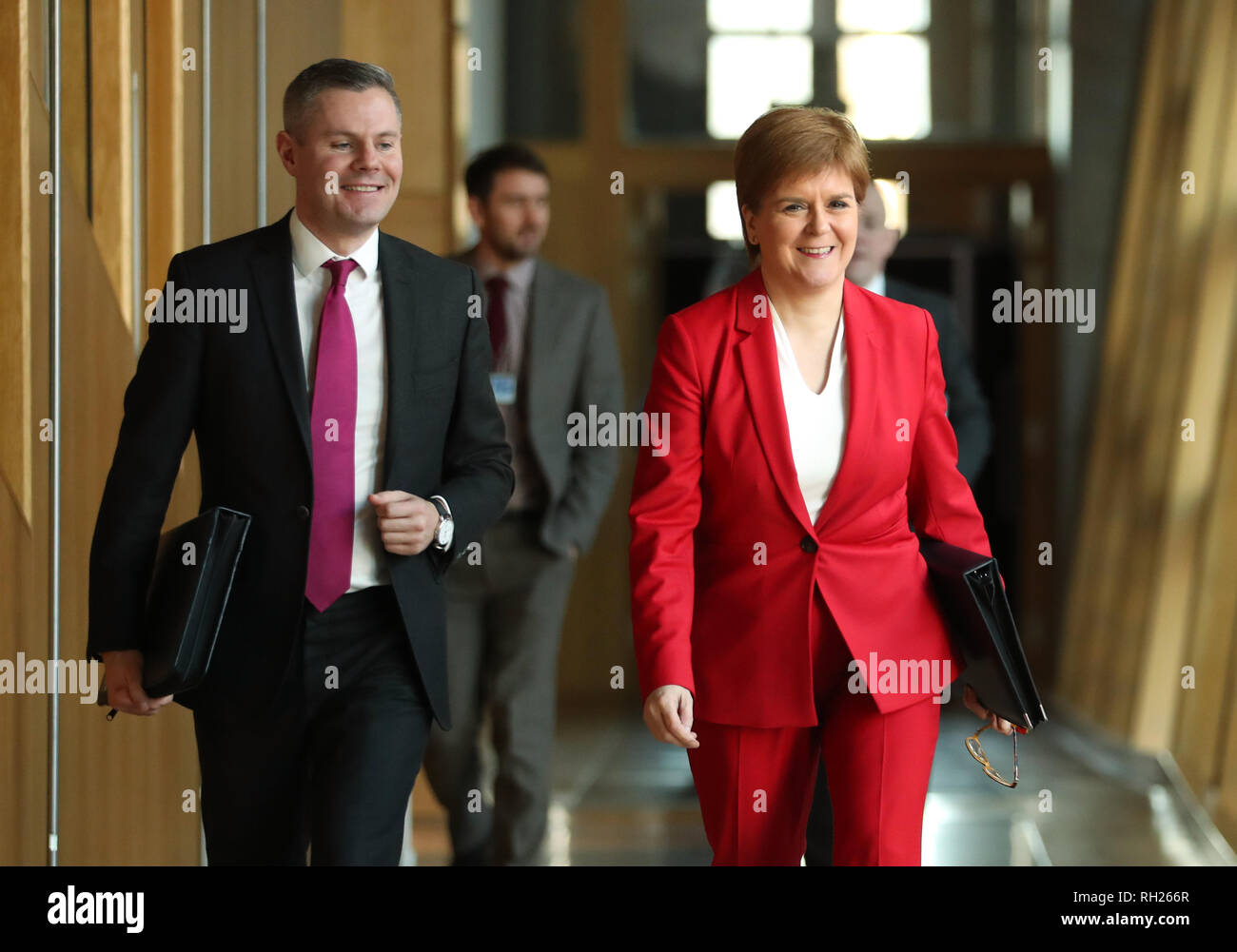 First Minister Nicola Sturgeon and Cabinet Secretary for Finance, Economy and Fair Work Derek Mackay arrive ahead of First Minister's Questions at the Scottish Parliament in Edinburgh. Stock Photo