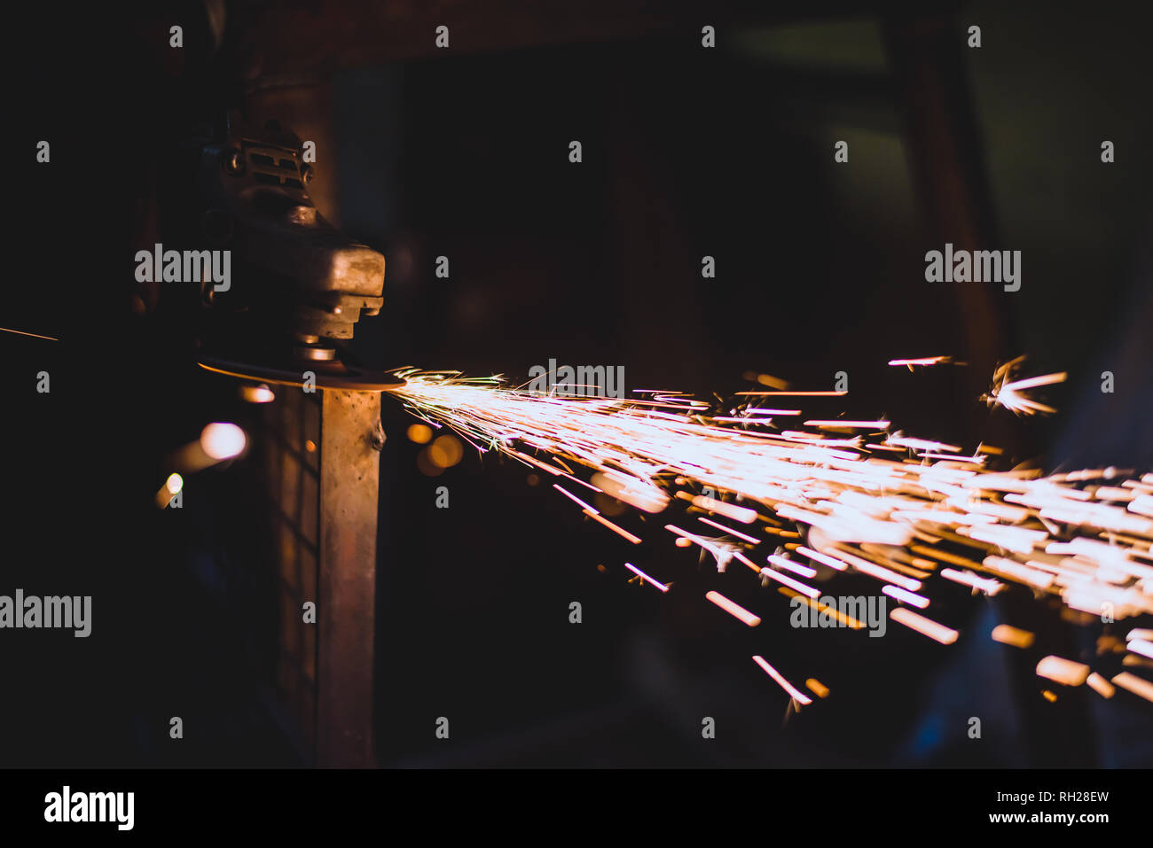 Worker using a grinder on a metal Stock Photo