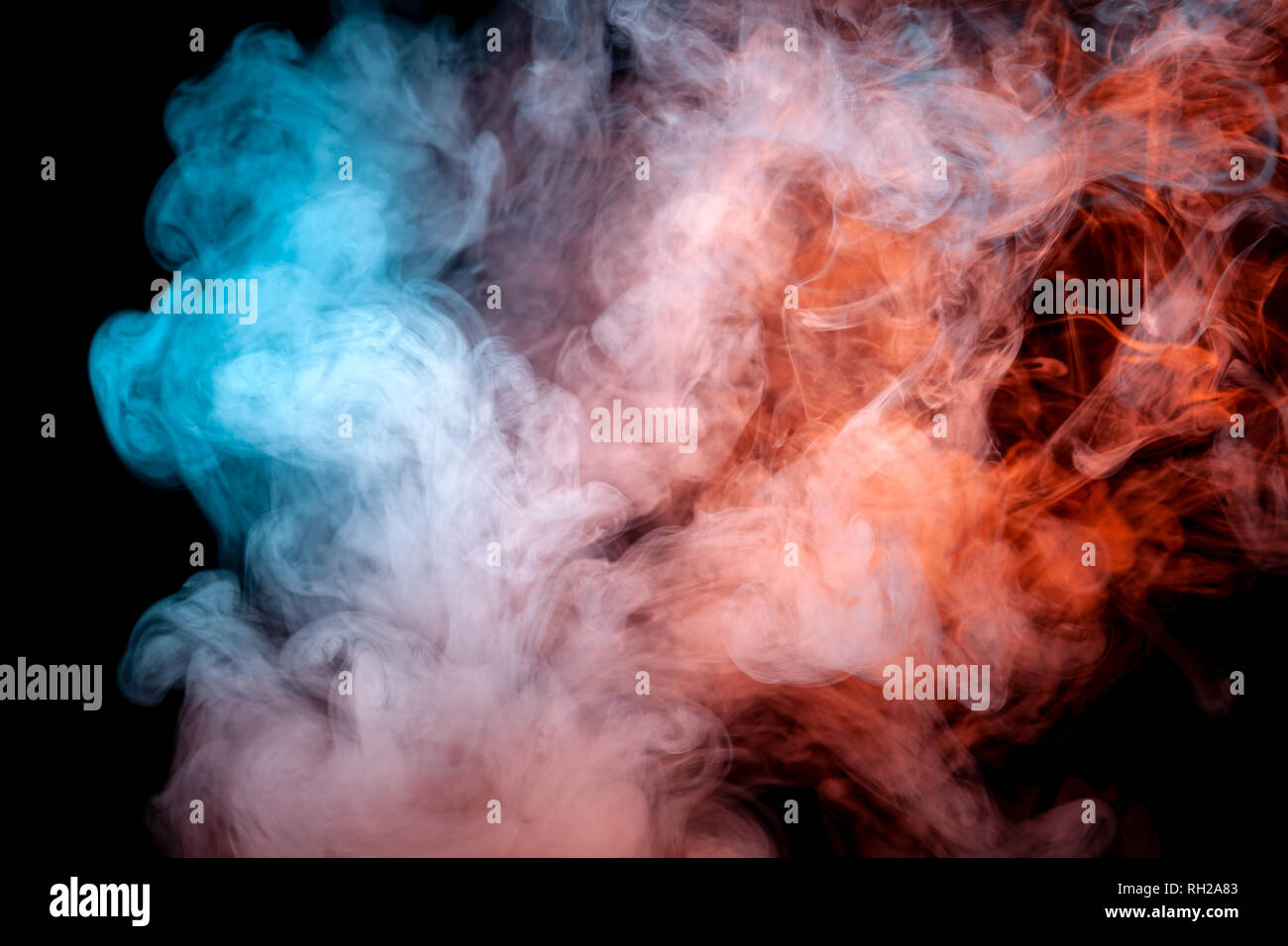 Blue-red smoke swirls on a black background depicting a beautiful pattern, decorative ornaments. Color transition by substance molecules. T-shirt prin Stock Photo