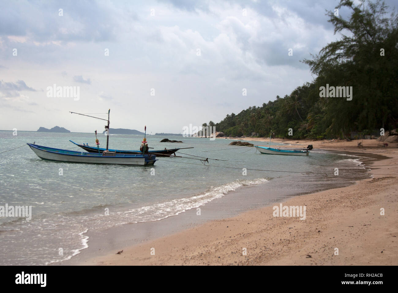 Koh Phangan island riviera with longtail boats and sand beach Stock