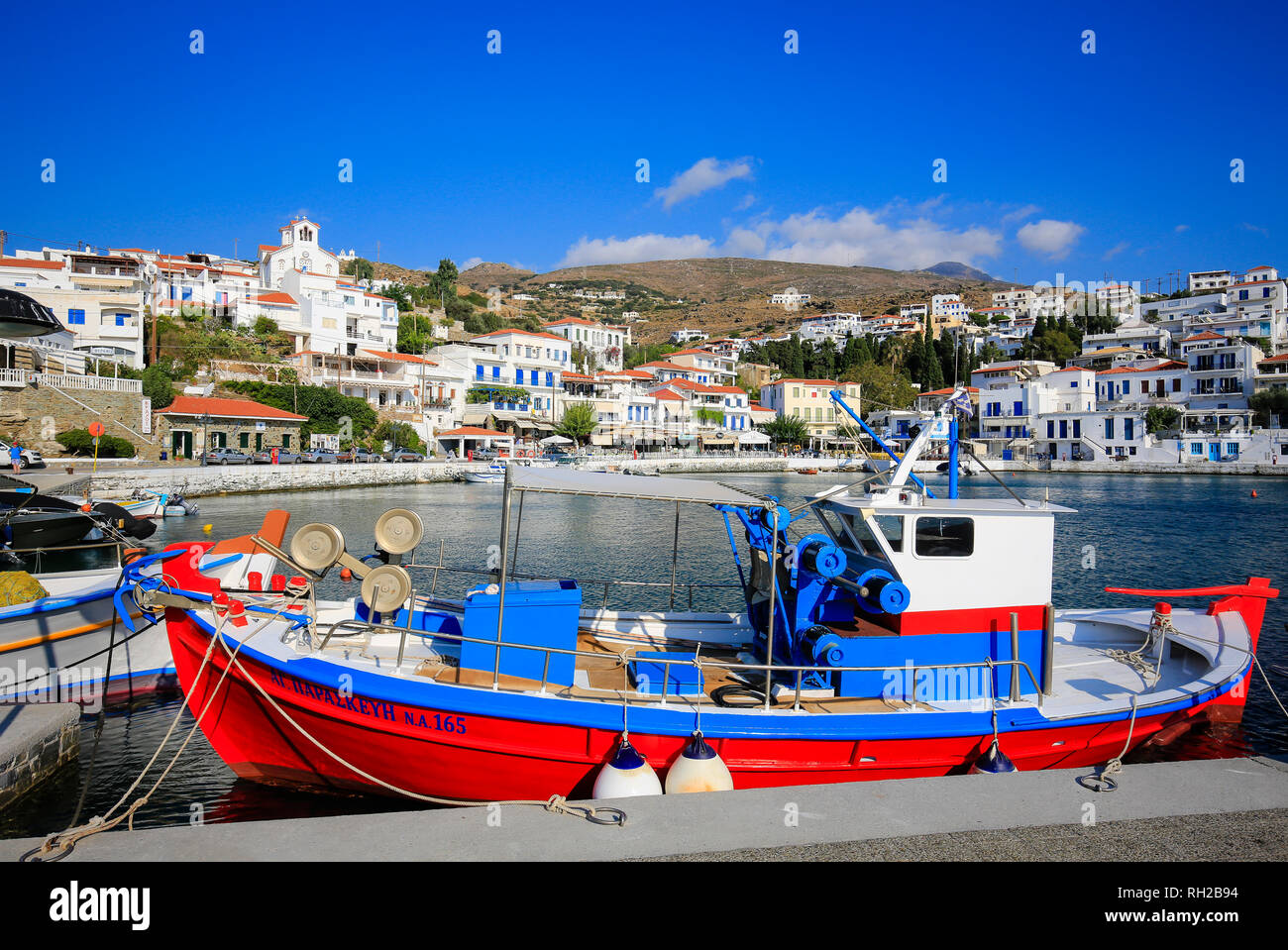 Batsi, Island of Andros, Cyclades, Greece - Colourful fishing boats in the harbour of Batsi, the holiday resort of the Greek island of Andros.  Batsi, Stock Photo