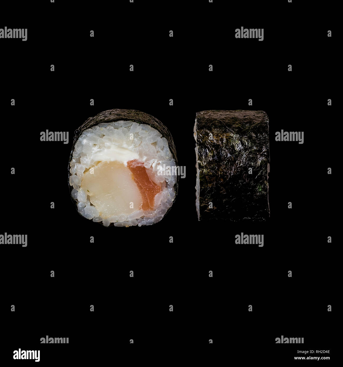 Sushi. Roll with shrimp, salmon and cream cheese, isolated in black background Stock Photo