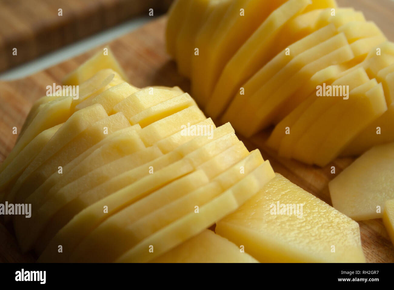 Heap of thin sliced potatoes close up Stock Photo