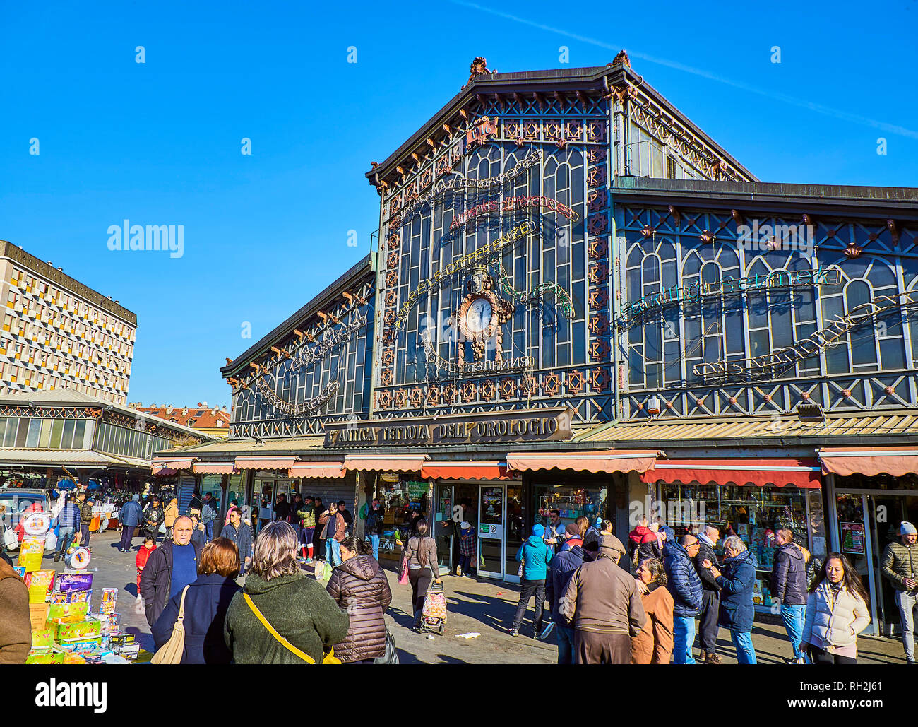 Citizens in front of the Antica Tettoia dell'Orologio building, the Fresh  food part of Porta Palazzo market. Turin, Piedmont, Italy Stock Photo -  Alamy