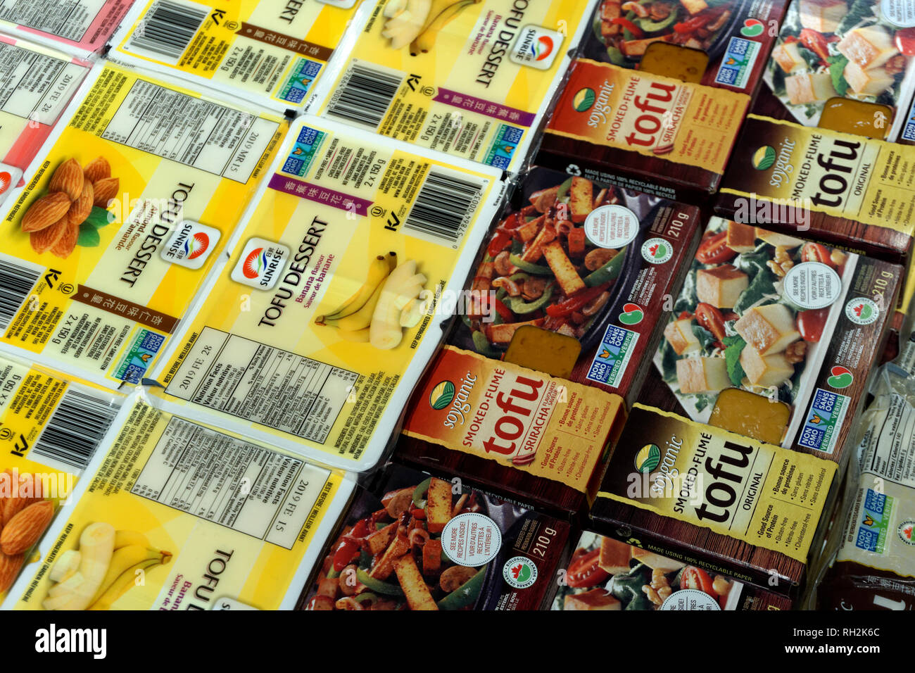 Packaged tofu products for sale in a grocery store, Vancouver, BC, Canada Stock Photo