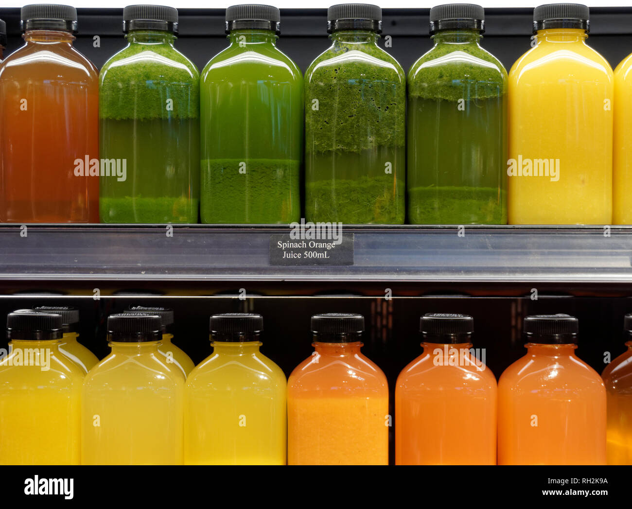 Bottles of freshly squeezed fruit and vegetable juces for sale in a grocery store, Vancouver, BC, Canada Stock Photo