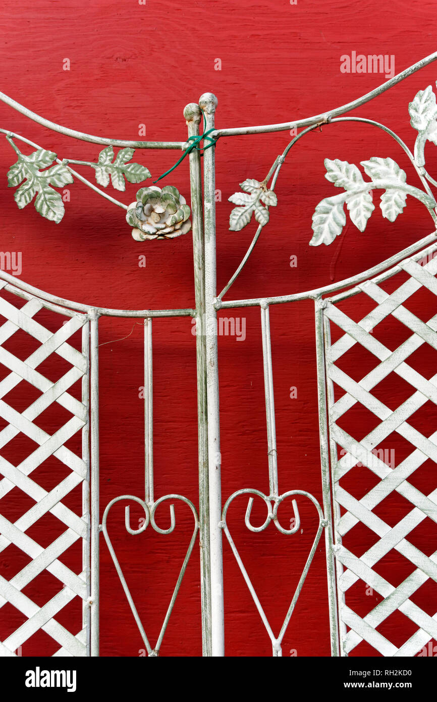 Ornate metal grill work with decorative floral design, hearts, and