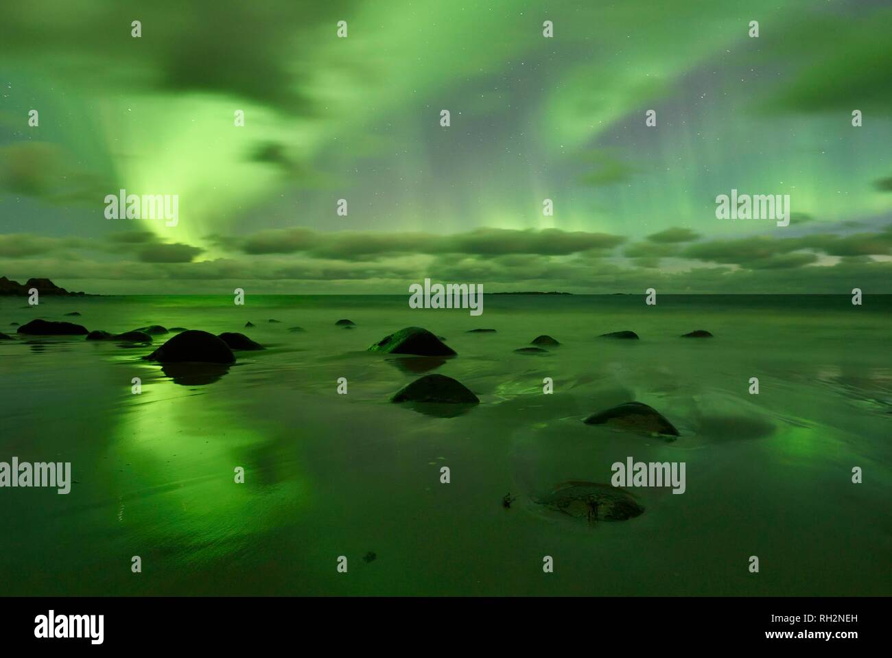 Northern Lights, Aurora Borealis above the beach of Utakleiv, Lofoten, Norway Stock Photo