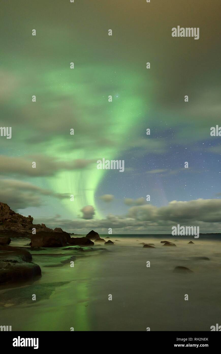 Northern Lights, Aurora Borealis above the beach of Utakleiv, Lofoten, Norway Stock Photo