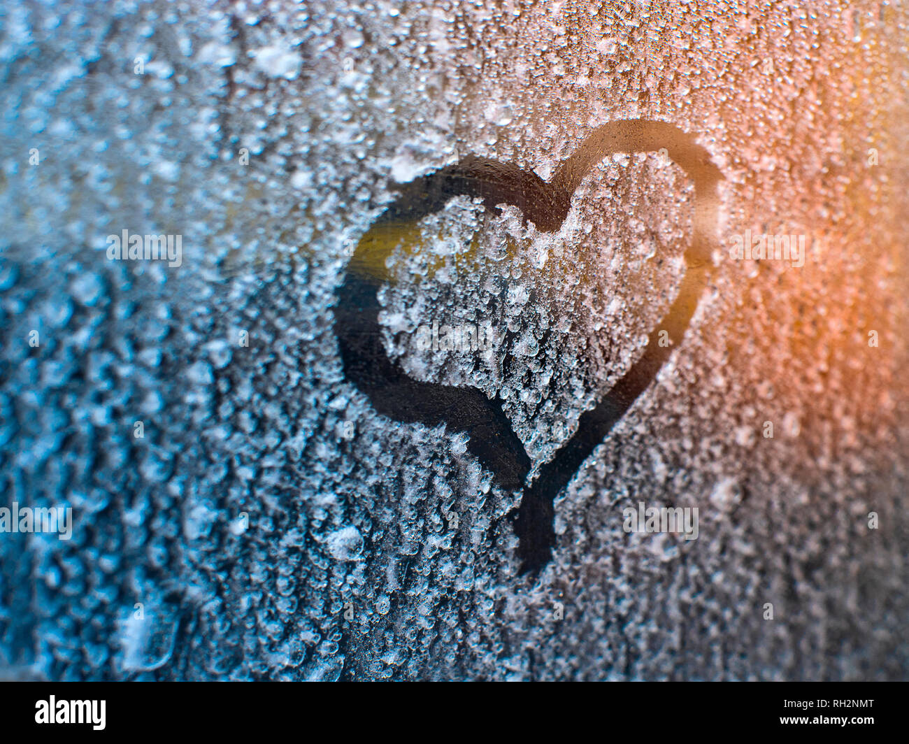 Drawn heart on the frozen window Valentines day concept. Stock Photo