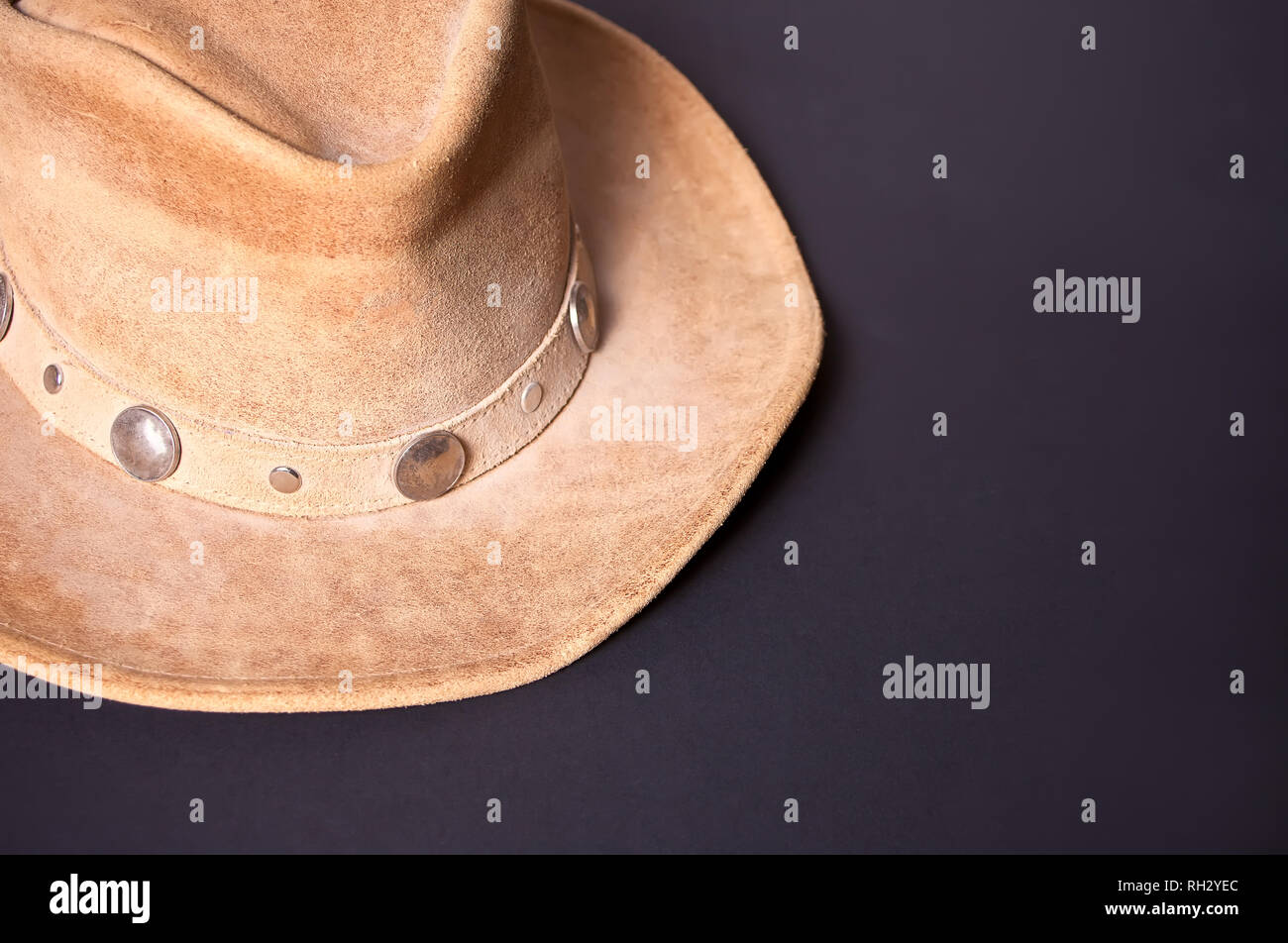 Brown cowboy hat on a black background Stock Photo