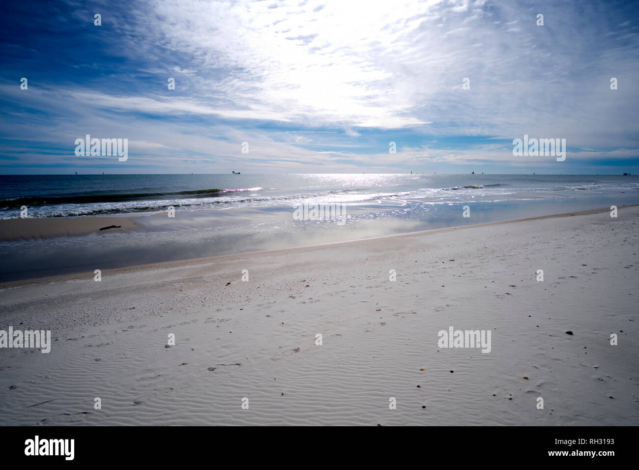 Mid-day sun illuminates the beach at Gulf Shores, Alabama near Fort Morgan. Stock Photo