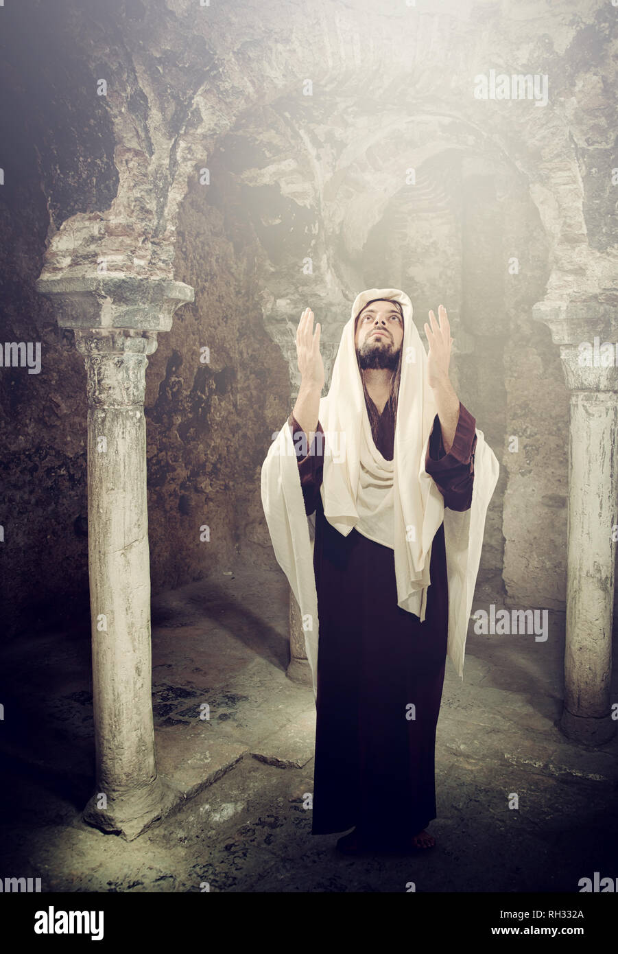 Jesus Christ praying and looking up to heaven Stock Photo
