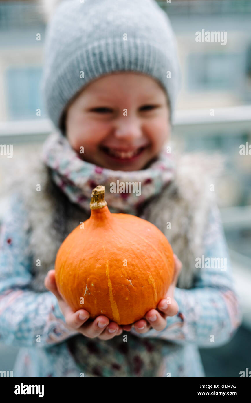 Girl having fun on swing in playground Stock Photo