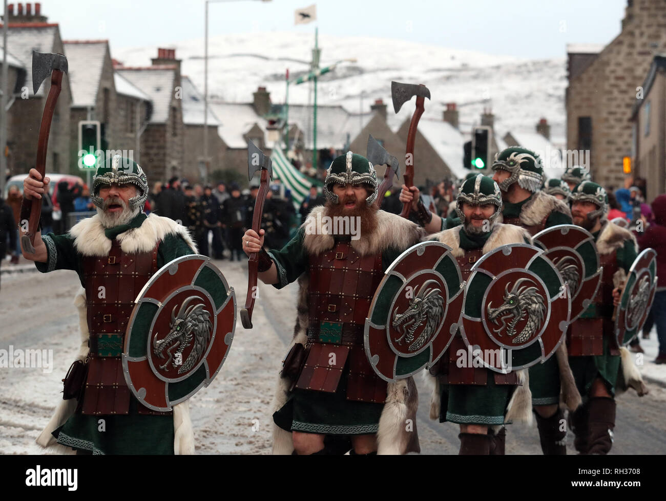 Members of the Jarl Squad march through Lerwick as snow falls on the Shetland Isles during the Up Helly Aa Viking festival. Originating in the 1880s, the festival celebrates Shetland's Norse heritage. PRESS ASSOCIATION Photo. Picture date: Tuesday January 29, 2019. Stock Photo
