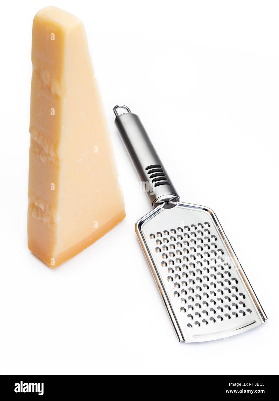 Italian hard cheese with grater on wooden background Stock Photo - Alamy
