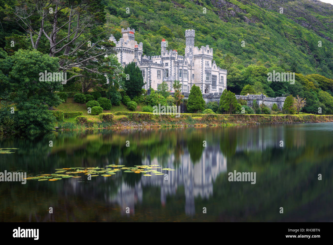 Kylemore Abbey in Ireland with reflections in the Pollacapall Lough Stock Photo