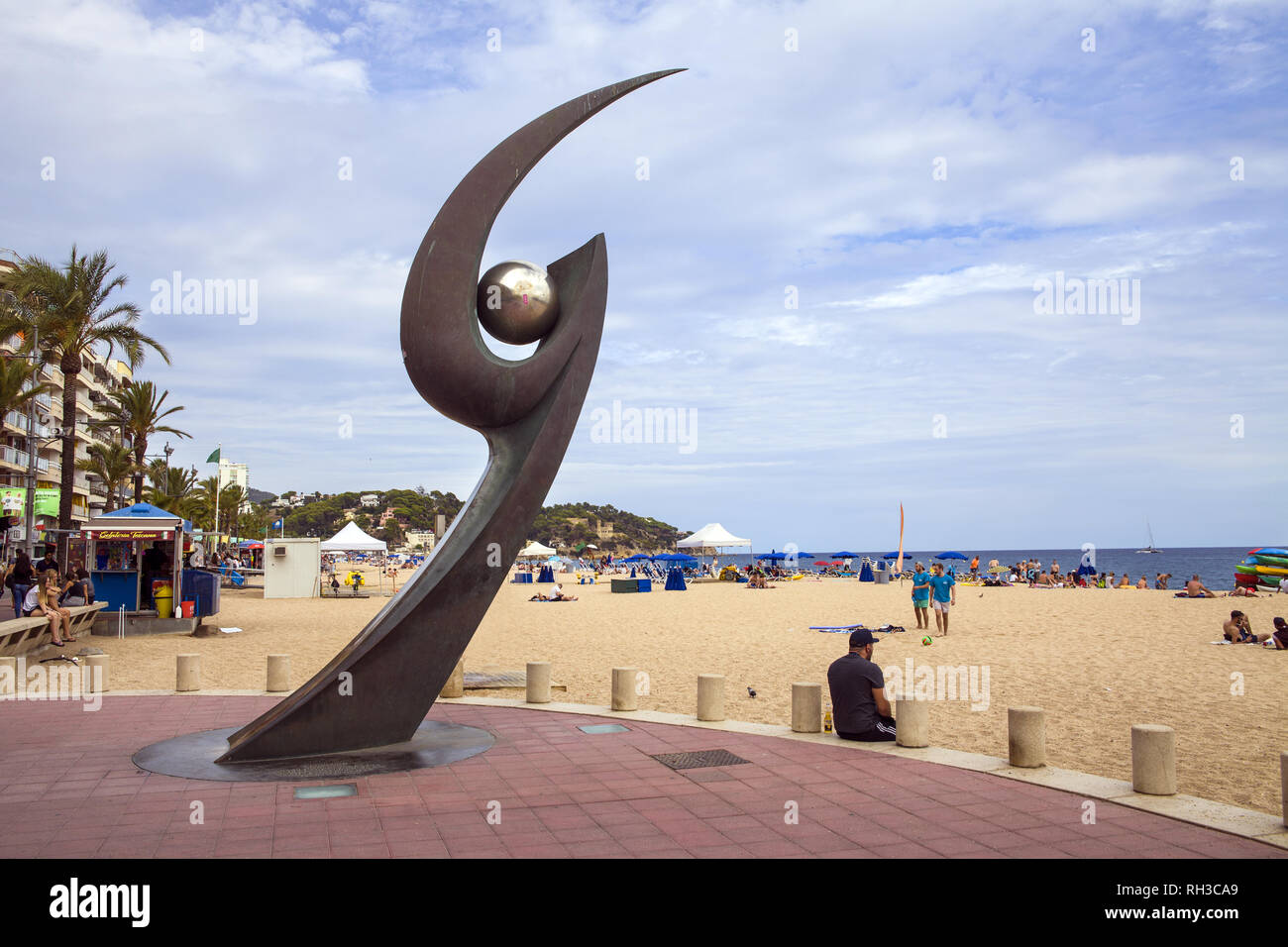 Monument Of L'Esguard In Lloret De Mar. Popular beach spot. Metal claw with the ball. Sculpture designed by Rosa Serra in commemoration of Meeting of  Stock Photo