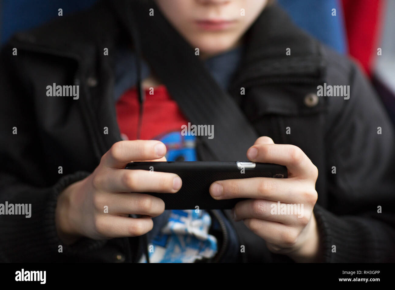 Boy with cell phone, close-up Stock Photo