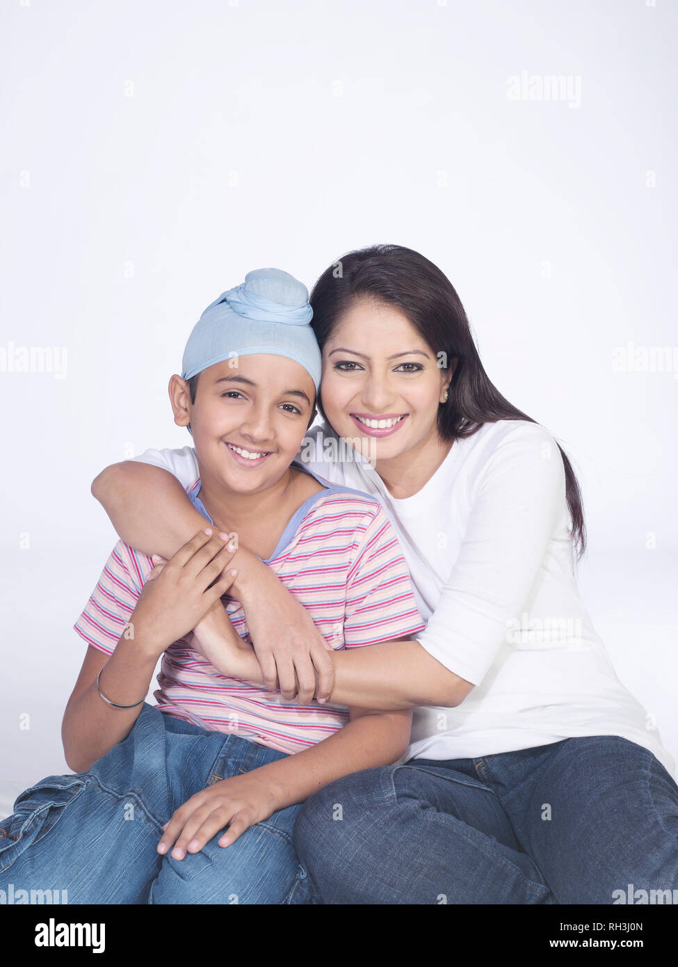 PORTRAIT OF A SARDARNI, SIKH WOMAN WITH HER  SON Stock Photo