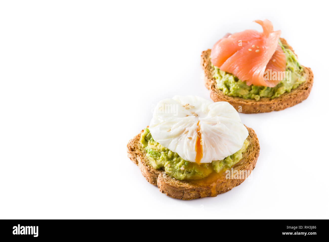 Toasted Breads With Avocado Poached Eggs And Salmon Isolated On White
