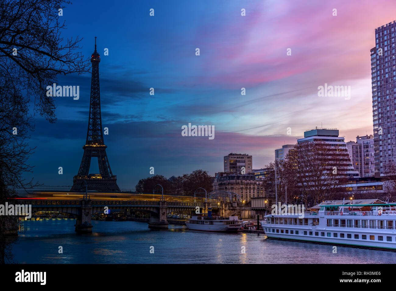 Night to Day over Eiffel tower in winter - Paris Stock Photo