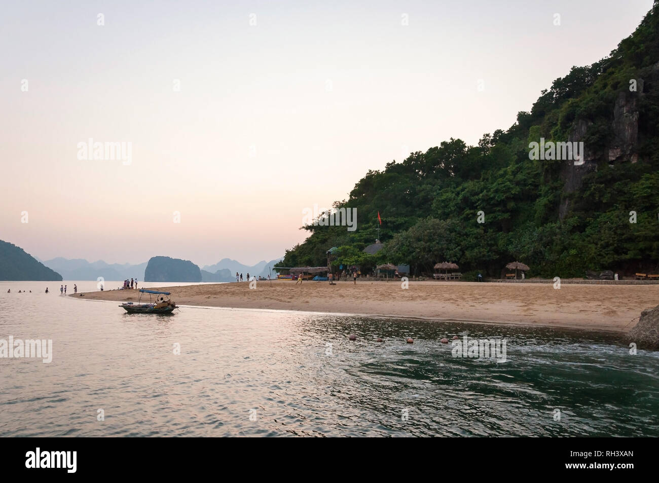 Ti Top beach or Bai bien Ti Top with tourists on the beach at sunset, Halong or Ha Long Bay, Vietnam Stock Photo