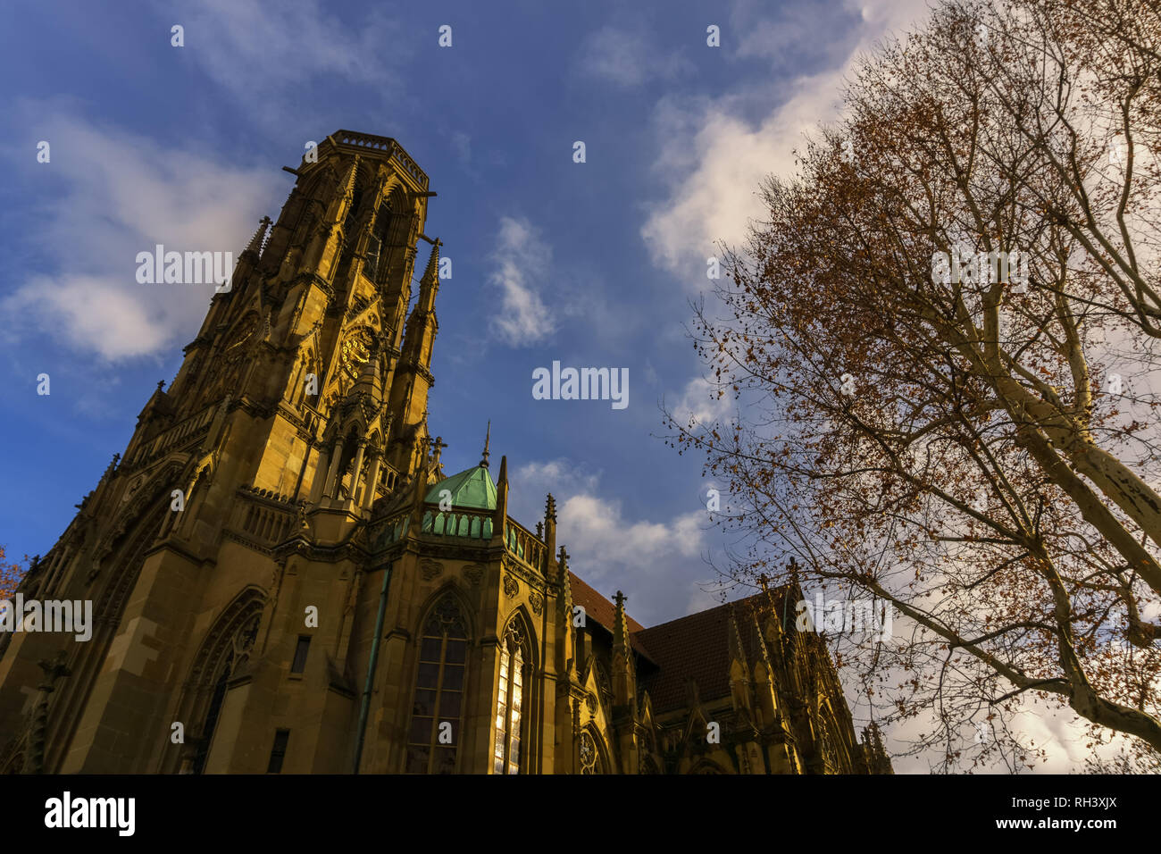 An old church below a cloudy and blue sky Stock Photo - Alamy