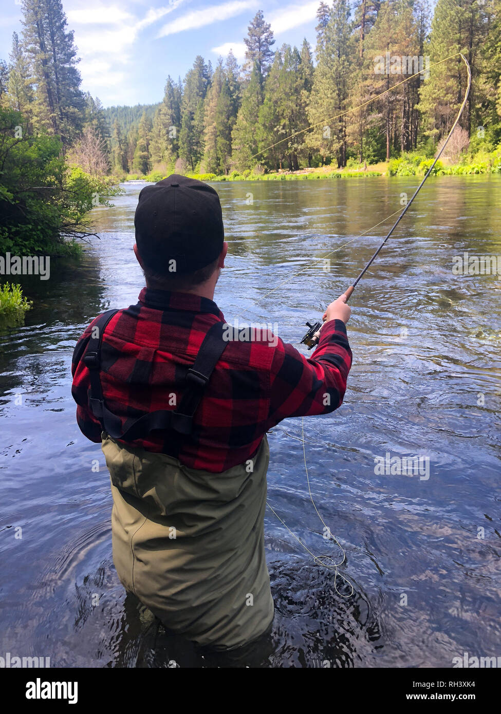 Metolius River Oregon Fly Fishing Trip with Fisherman Casting Stock Photo