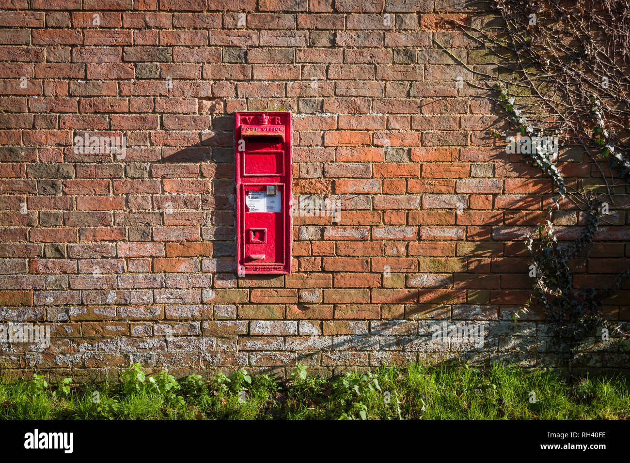 Old Victorian post box built into old red brick wall in Wiltshire ...