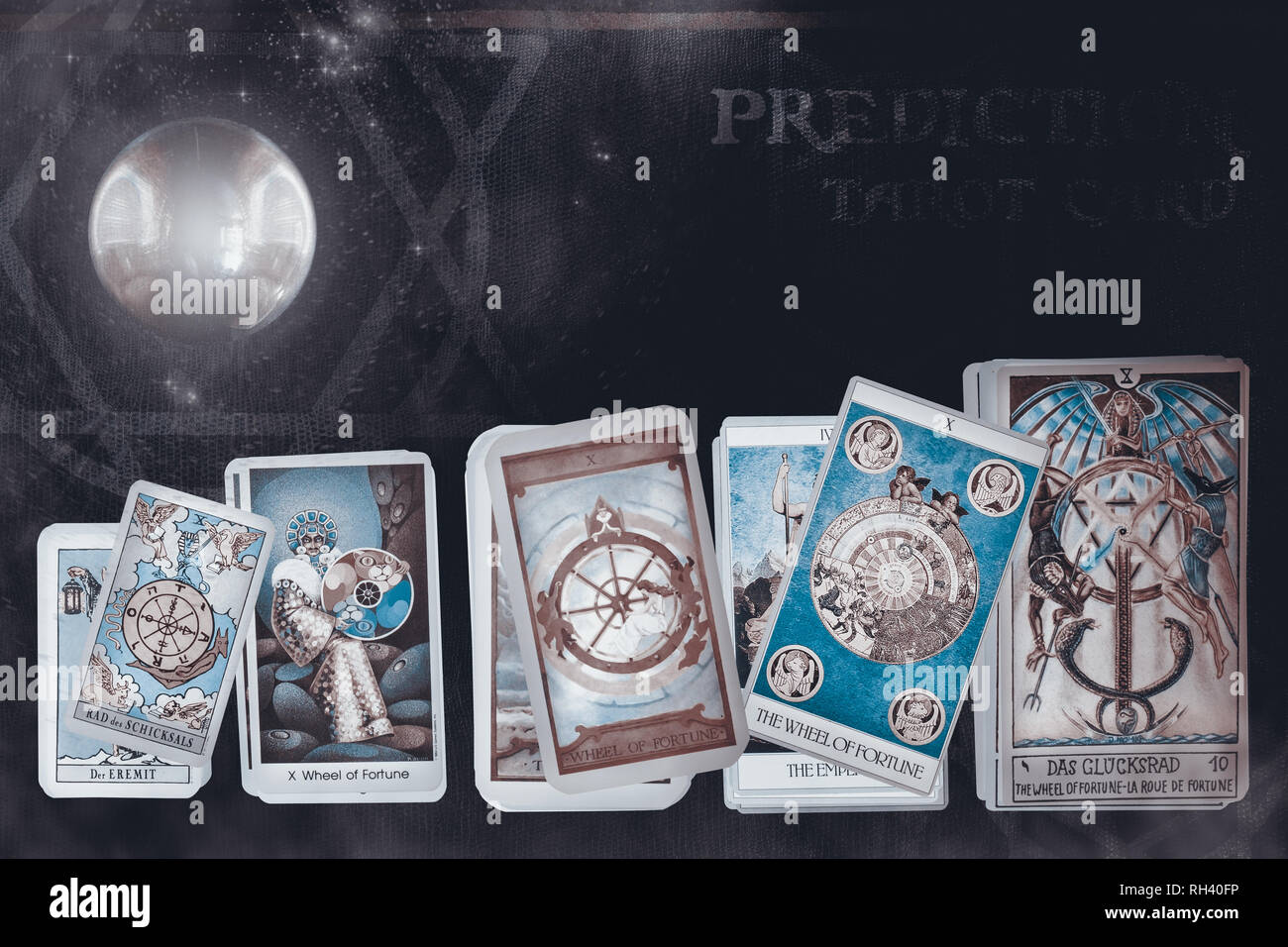 View of tarot card on old leather with crystal ball. The Wheel of fortune. Stock Photo