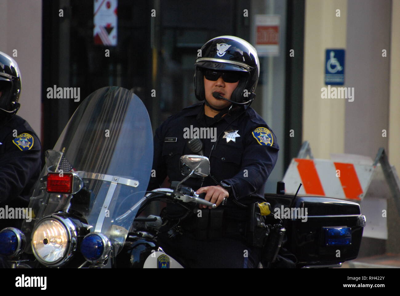 Oakland police Officer Alwin Luu patrols on motorcycle outside a Kamala Harris for President rally in downtown Oakland on Jan. 27, 2019. Stock Photo