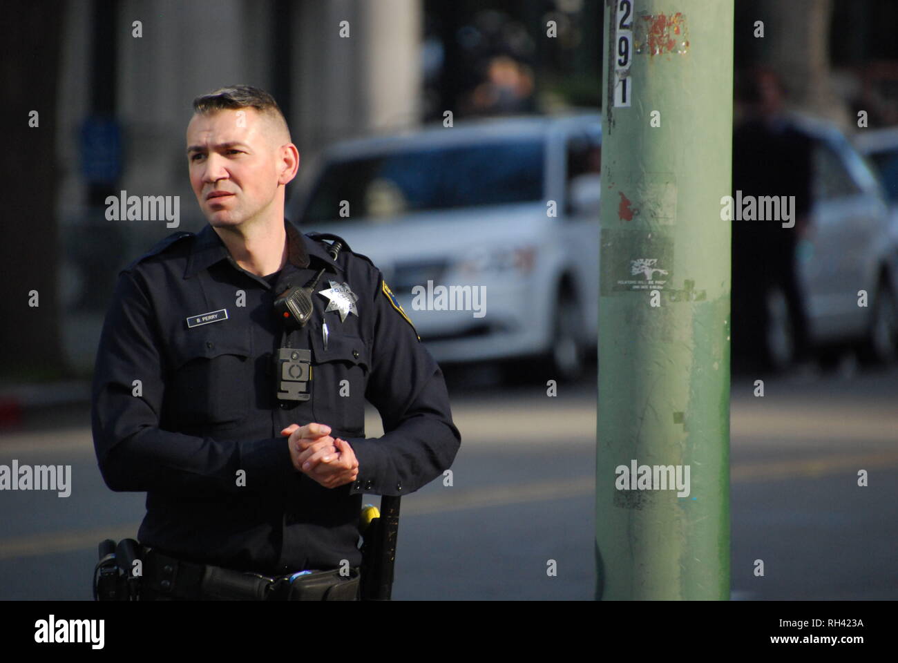 Oakland police Officer Brandon Perry providing security outside a Kamala Harris for President rally in downtown Oakland on Jan. 27, 2019. Stock Photo