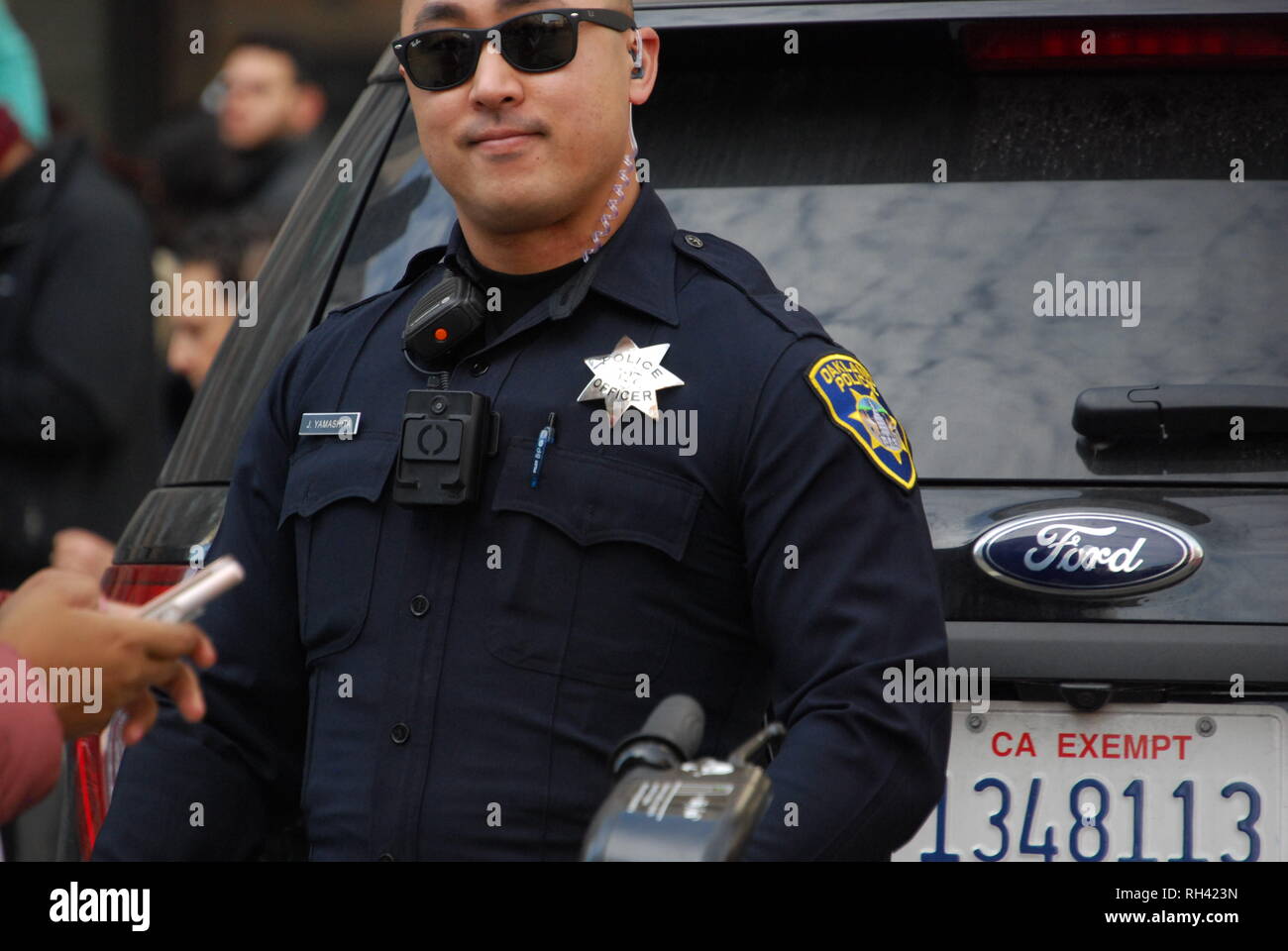 Oakland police Officer James Yamashita providing security outside a Kamala Harris for President rally in downtown Oakland on Jan. 27, 2019. Stock Photo