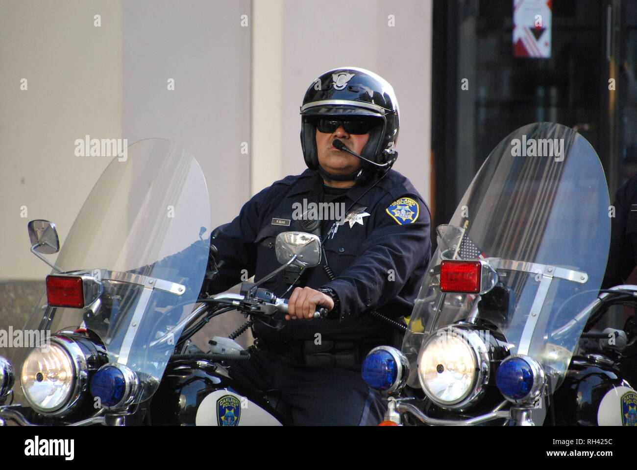 Oakland police Officer Pedro Elias patrols on motorcycle outside a Kamala Harris for President rally in downtown Oakland on Jan. 27, 2019. Stock Photo