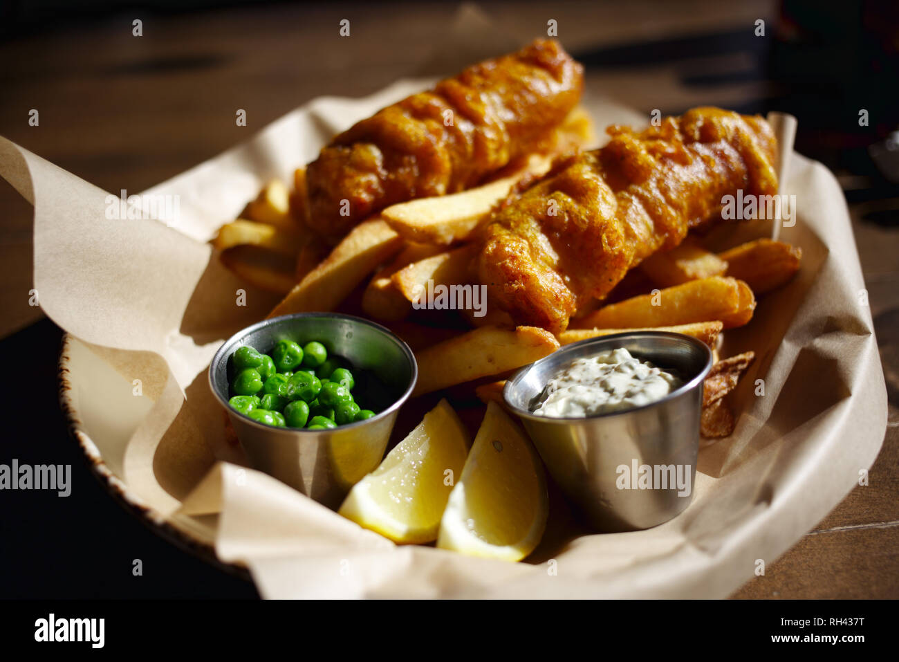 Amazing Fish and Chips - Fish and chips ordered at a sidewalk cafe in Downtown Huntington Beach, CA Stock Photo
