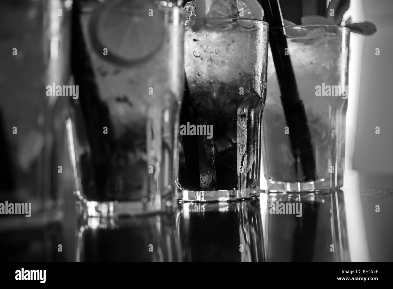 Enjoy a drink. Iced drinks in cocktail glasses in bar. Alcoholic mixed