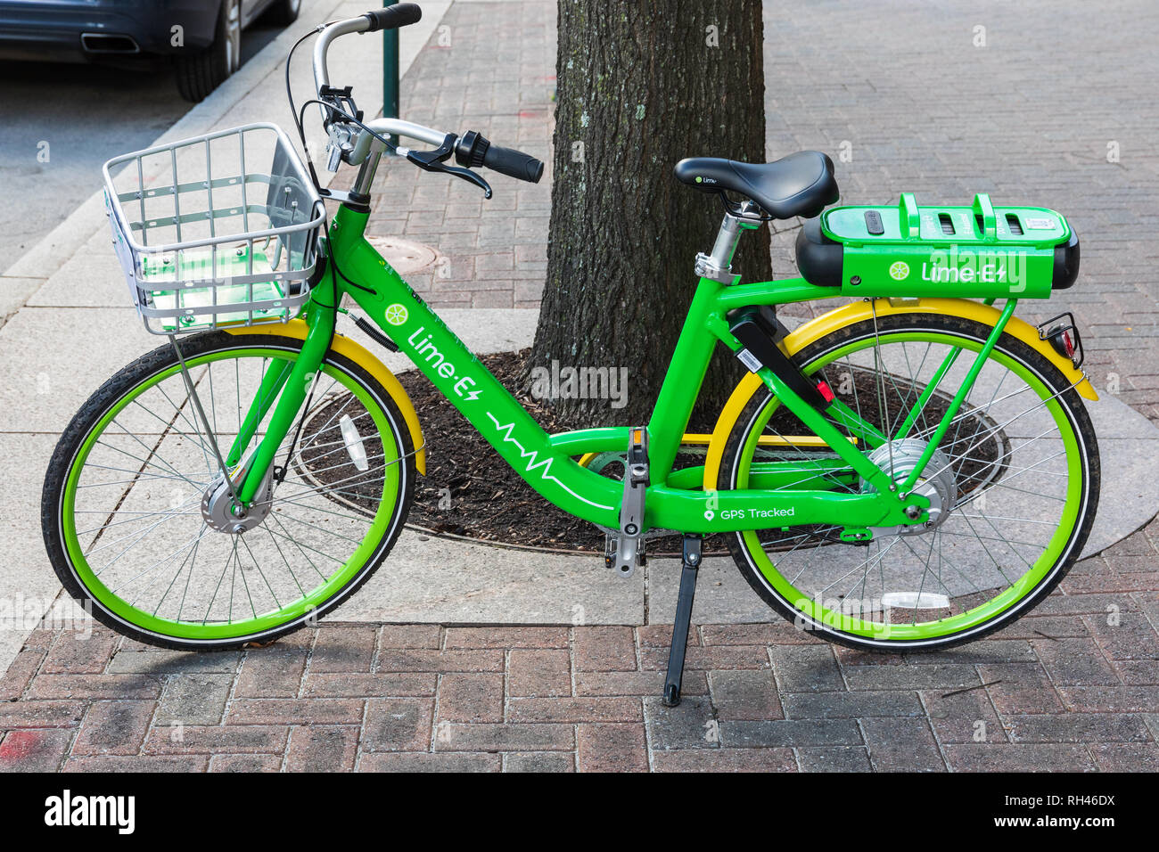 CHARLOTTE, NC, USA-1/24/19: A Lime e-assist bicycle parked on Tryon St. sidewalk. The bikes are unlocked using a smartphone app. Stock Photo
